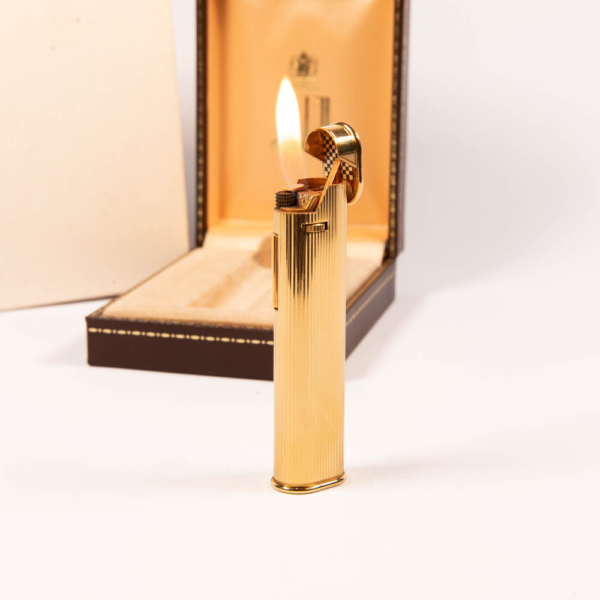 Vintage Gold Dunhill Dress lighter in front of box lit