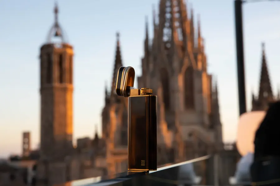 Cartier Trinity lighter in front of Barcelona cathedral at sunset