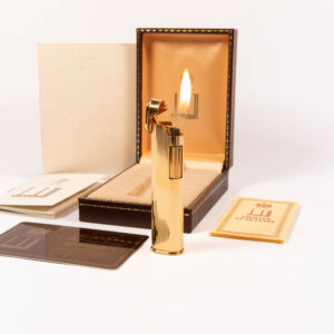 Vintage Gold Dunhill Dress lighter in front of box lit