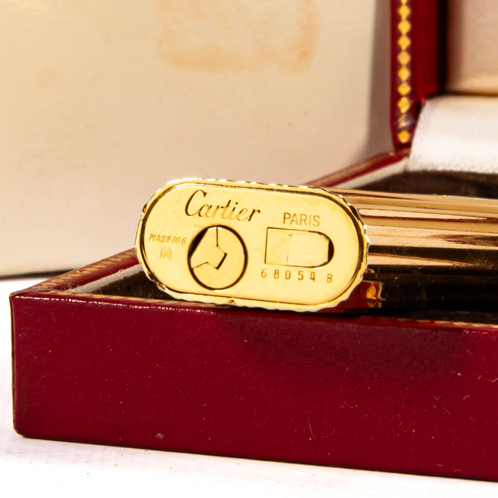 Base of a vintage gold plated Cartier Les Must lighter marked Cartier Paris, Plaqué or G and serial number 68054 B